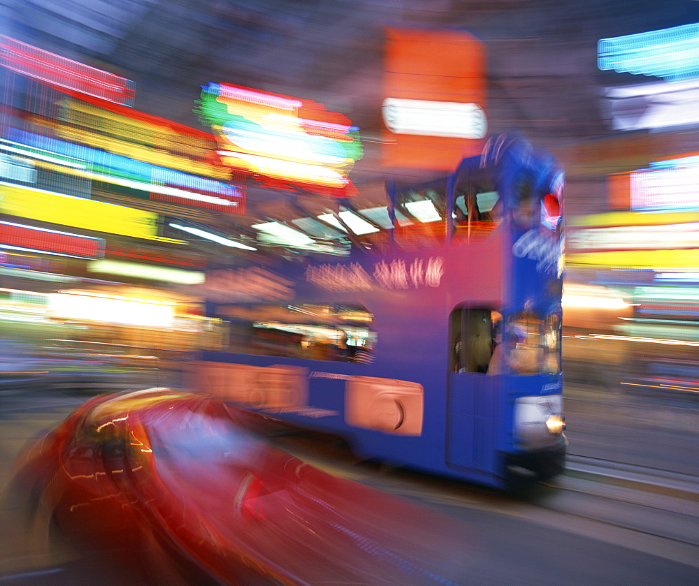 Tram in blurred motion at dusk, Causeway Bay, Hong Kong, China, Asia