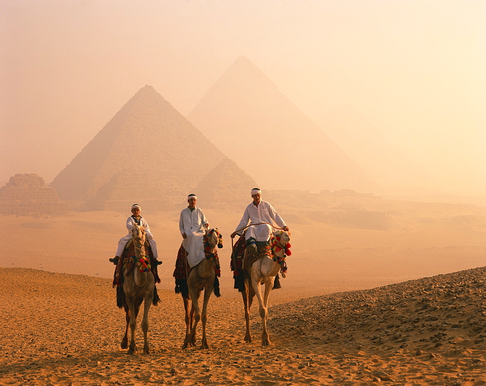 Camel riders at Giza Pyramids, UNESCO World Heritage Site, Giza, Cairo, Egypt, North Africa, Africa