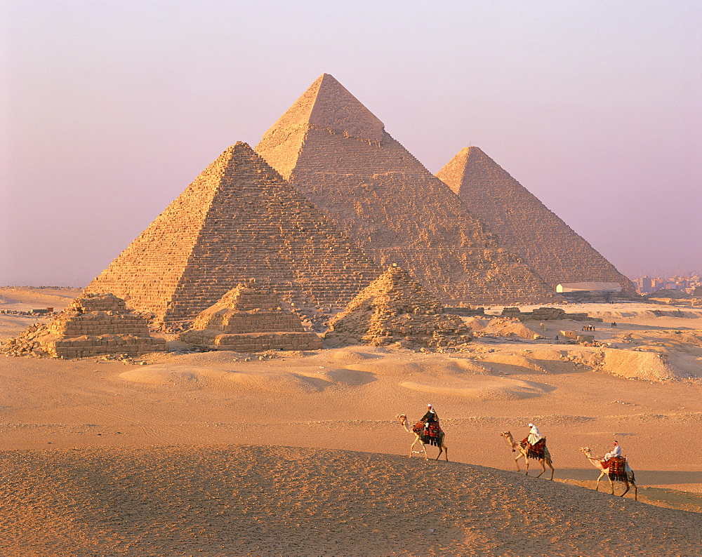 Camel riders at Giza Pyramids, UNESCO World Heritage Site, Giza, Cairo, Egypt, North Africa, Africa