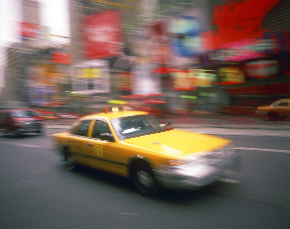 Yellow cab on the street in Times Square in New York, United States of America, North America