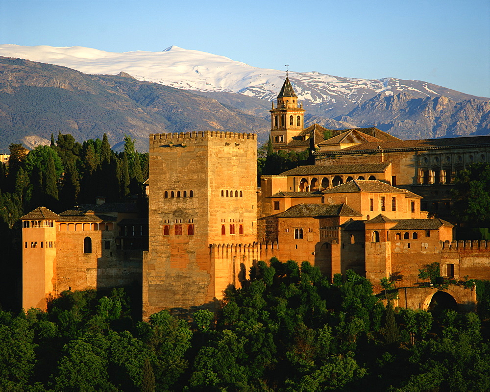 The Alhambra Palace, UNESCO World Heritage Site, with the snow covered Sierra Nevada mountains in the background, Granada, Andalucia, Spain, Europe