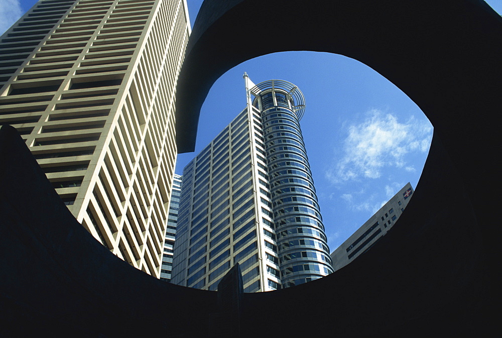 Skyscrapers of the Raffles Business Centre from a low angle seen through the frame of sculpture, Singapore, Southeast Asia, Asia