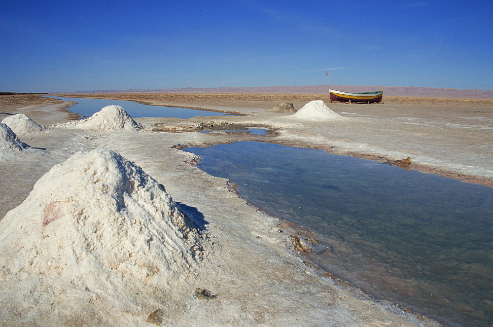 Piles of salt on salt flats, Chott El Jerid, Tunisia, North Africa, Africa