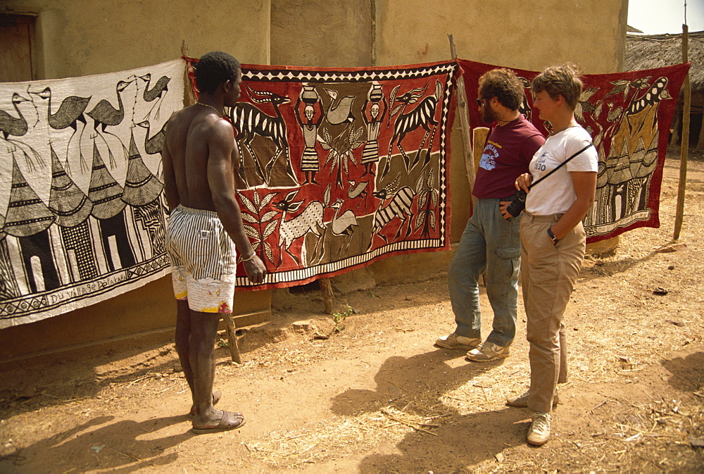 Tourists being shown batiks, near Korhogo, Ivory Coast, West Africa, Africa