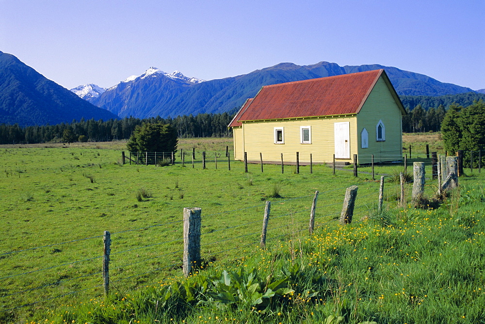 Field and colourful church at Jacobs River, South Island, New Zealand, Pacific