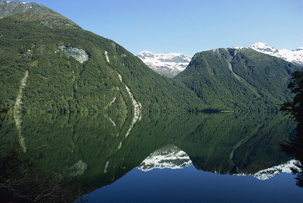 Reflection of mountains in the water of Lake Gunn in the Fjordland National Park, UNESCO World Heritage Site, Southland, New Zealand, Pacific