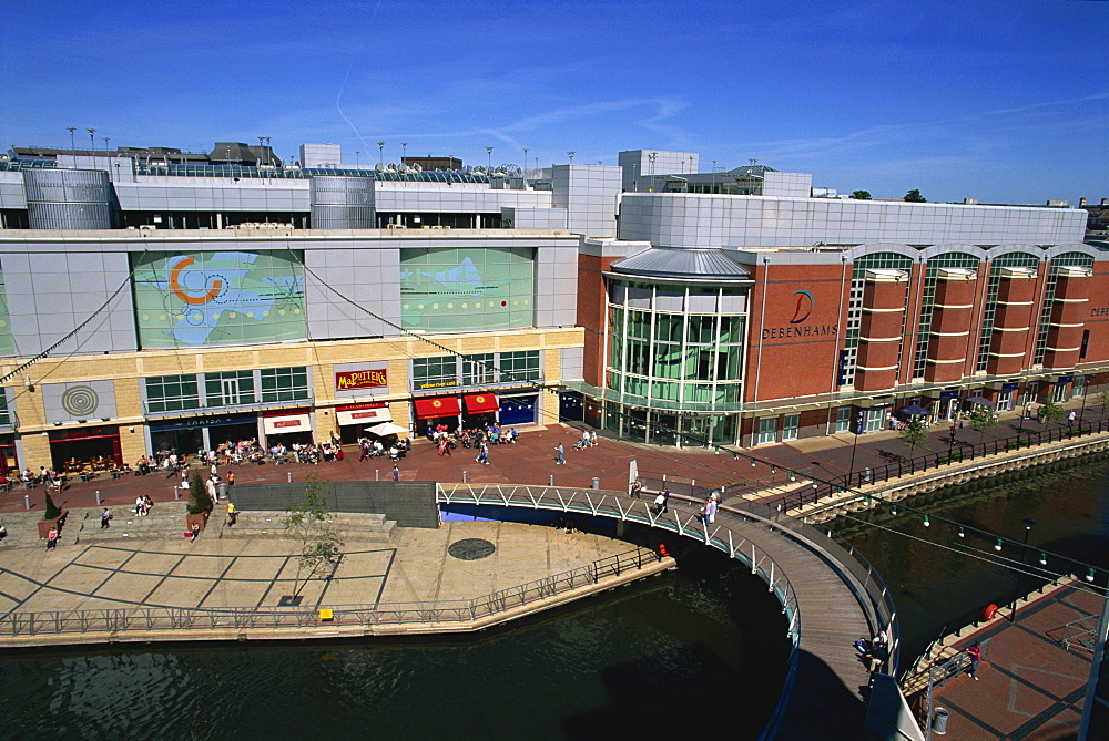 Eastern end of the Oracle shopping complex with curved footbridge over River Kennet and Debenham's store, Reading, Berkshire, England, United Kingdom, Europe