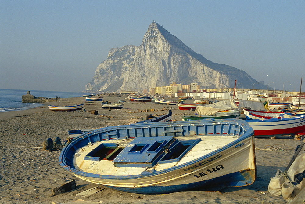 Boats pulled onto beach below the Rock of Gibraltar, Gibraltar 