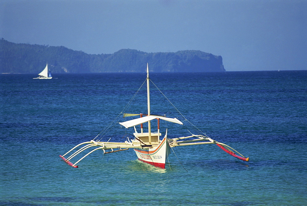 Outrigger boat offshore from the Boracay Island resort in the Philippines, Southeast Asia, Asia