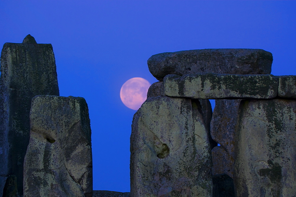 Moon behind Stonehenge, UNESCO World Heritage Site, Wiltshire, England,  United Kingdom, Europe