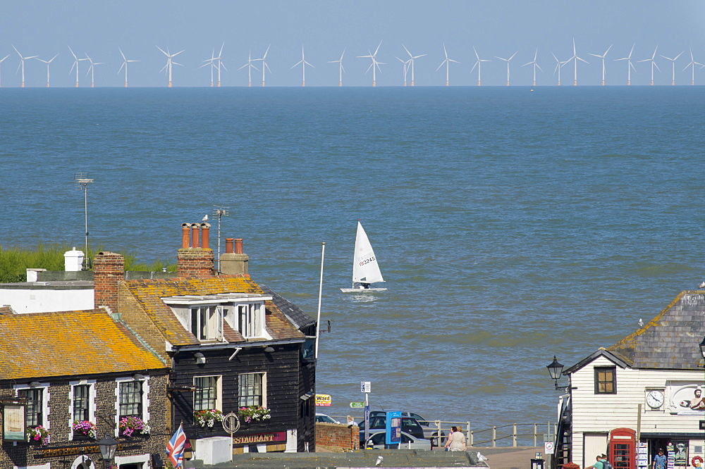 Sailing dinghy passes Broadstairs with Thanet Windfarm in background, Kent, England, United Kingdom, Europe