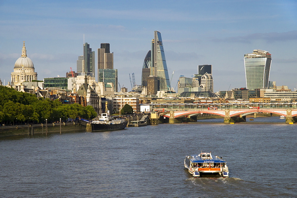 Classic cityscape across Blackfriars Bridge shows City CBD and St. Pauls Cathedral, London, England, United Kingdom, Europe