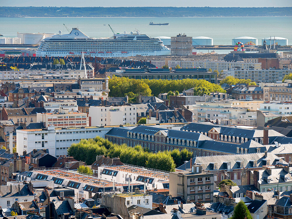 City skyline towards Seine estuary with cruise ship in docks, Le Havre, Normandy, France, Europe