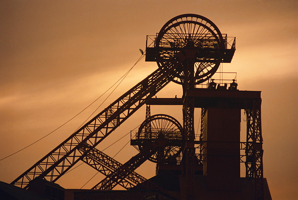 Coalmine pithead silhouetted at dusk, South Wales, United Kingdom, Europe