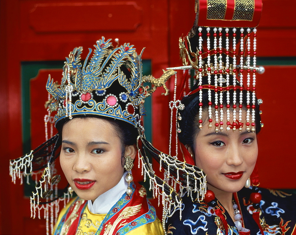 Portrait of two women in the traditional costume of the Middle Kingdom in Hong Kong, China, Asia