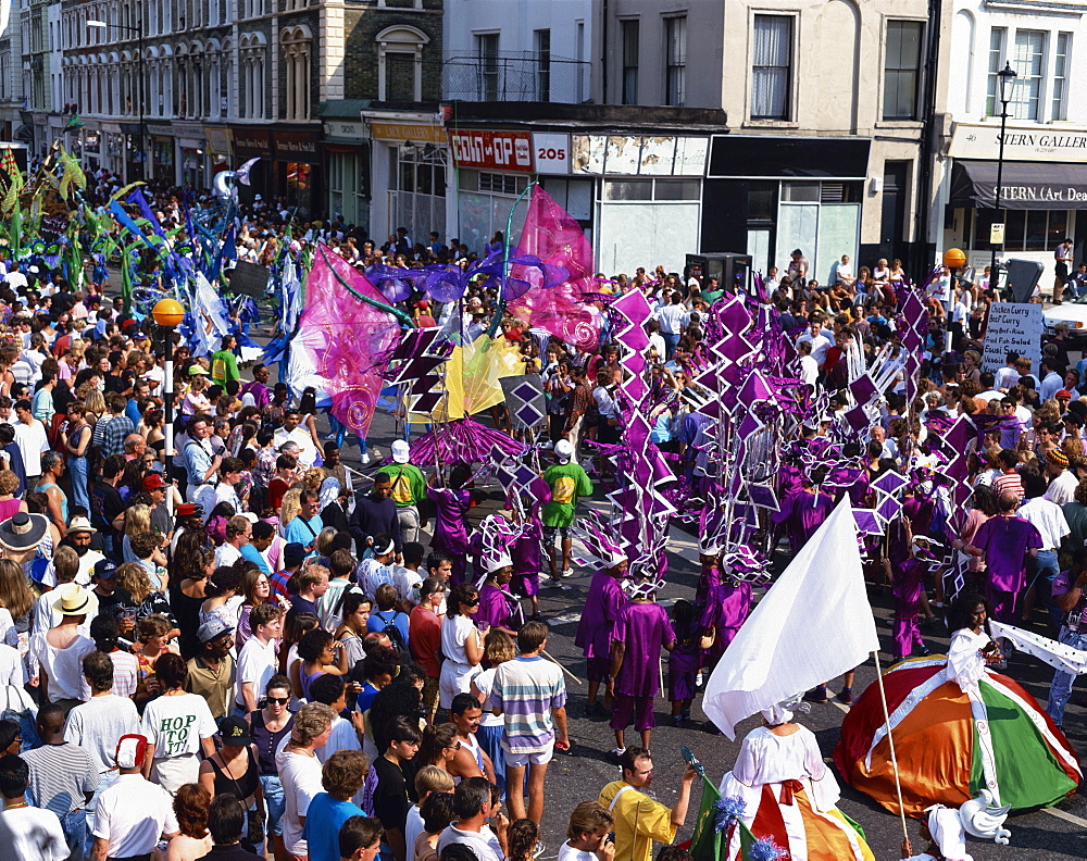 Procession and crowds at the Notting Hill Carnival, Notting Hill, London, England, United Kingdom, Europe