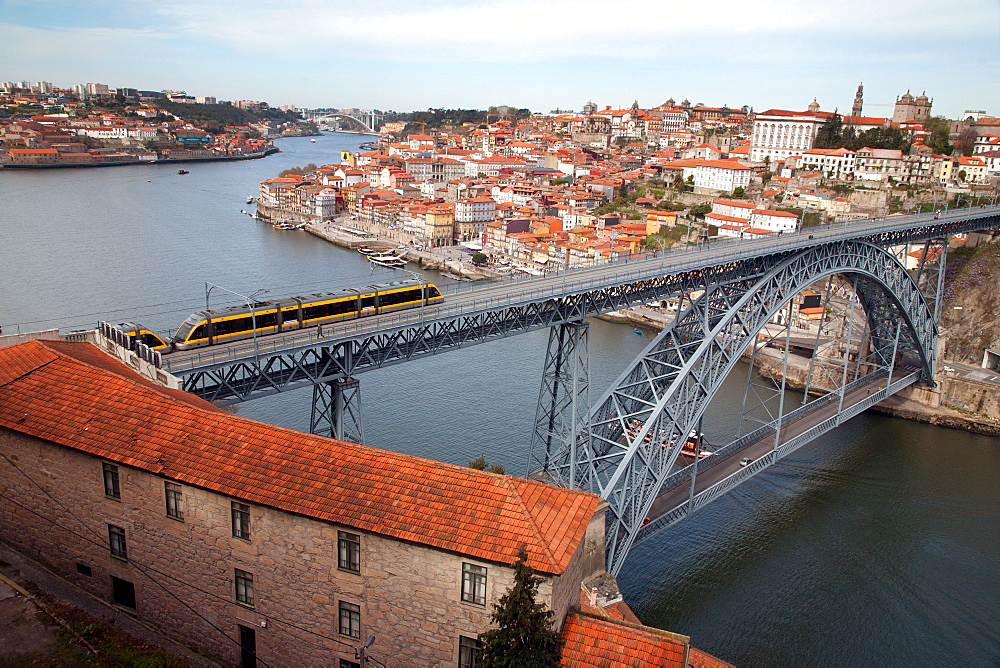 The Dom Luis 1 Bridge over the River Douro showing Porto Metro light rail in transit and Arrabida Bridge in background, Porto (Oporto), Portugal, Europe