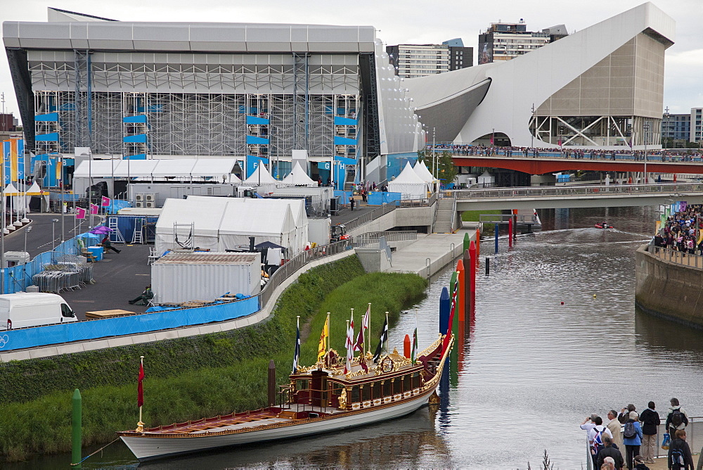 View of the Royal Barge Gloriana showing the Aquatics Centre and Water Polo Arena in the background, Olympic Park, Stratford, London, England, United Kingdom, Europe