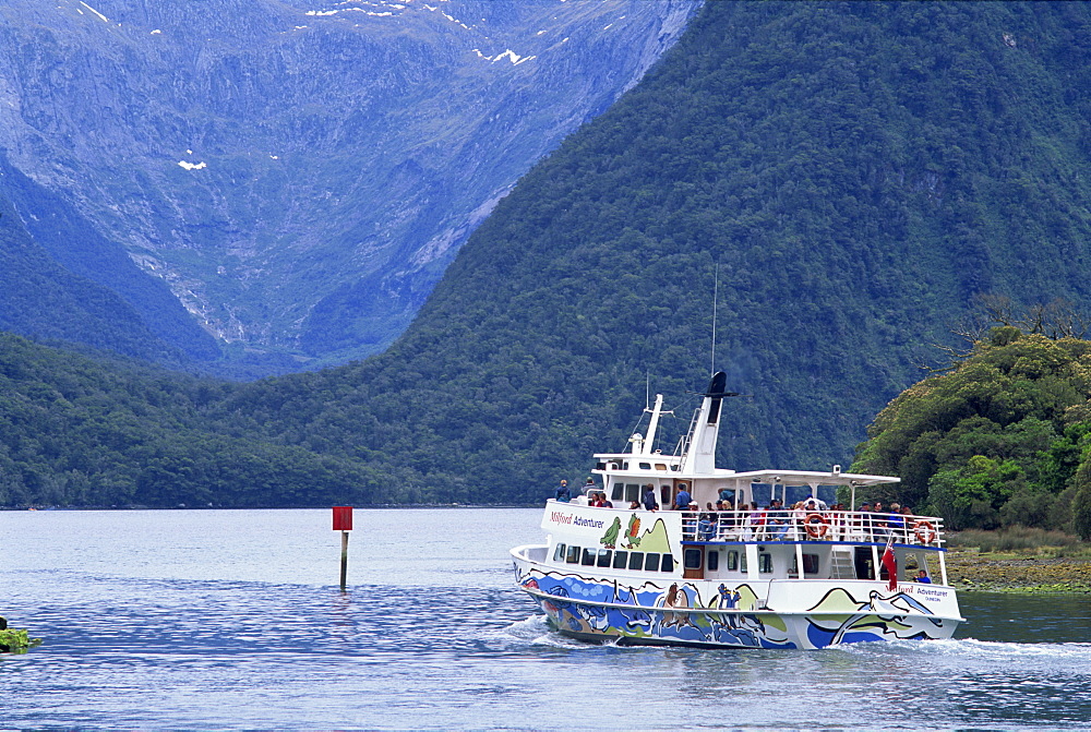 Tourists on a Fiord Boat Tour on the Milford Sound in the South Island of New Zealand, Pacific