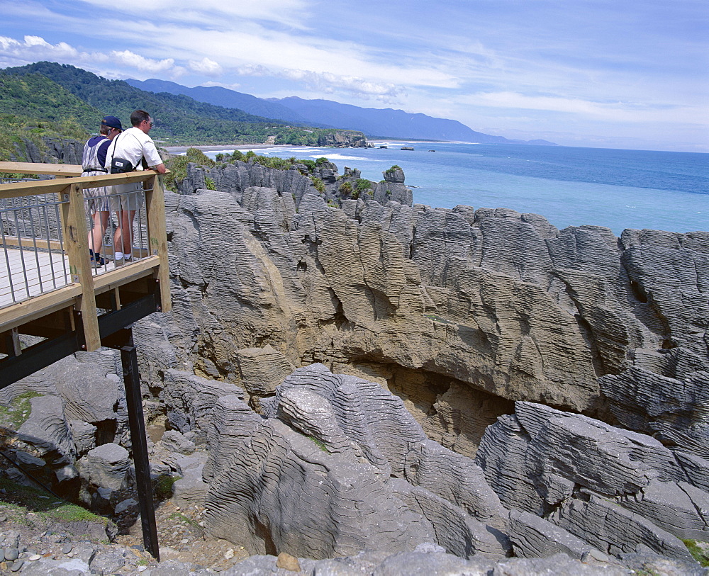 Tourists on viewing platform, Punakaiki, Pancake Rocks and blowholes, Paparoa National Park, Westland, South Island, New Zealand, Pacific