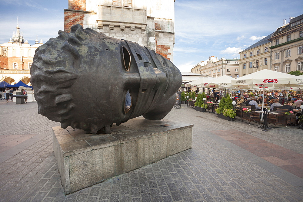 Eros Bendato, bronze sculpture by Igor Mitoraj in Rynek Glowny, the main market square of the Old Town, UNESCO World Heritage Site, Krakow, Poland, Europe