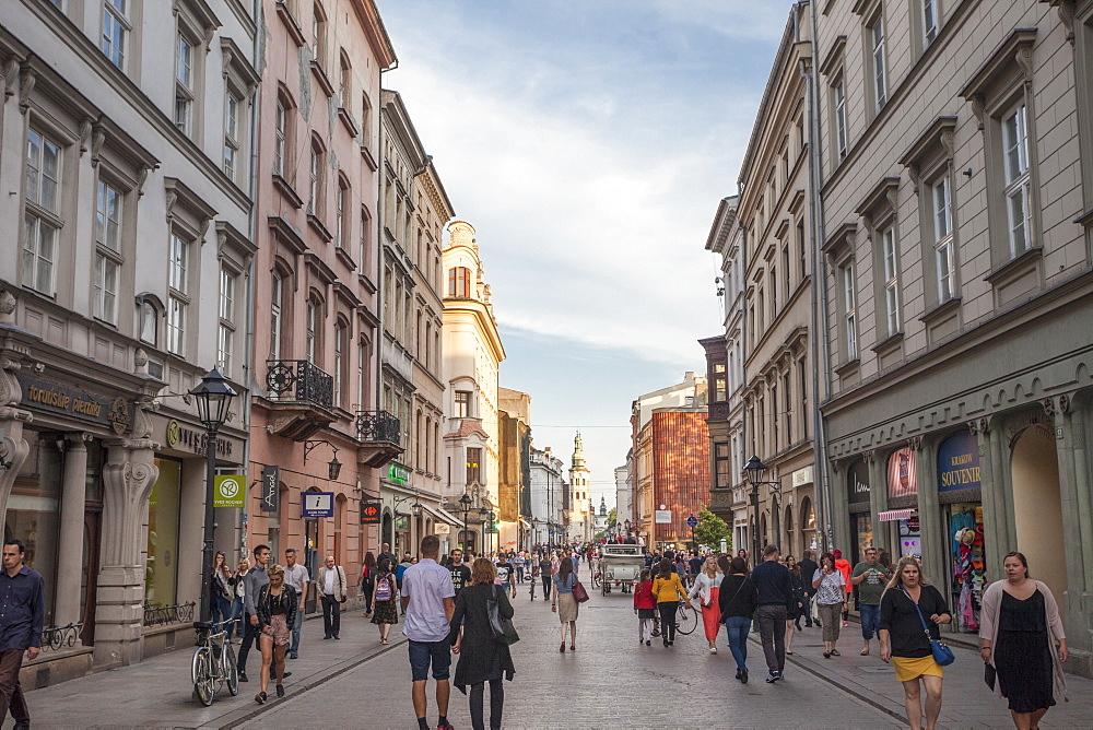 Street scene of tourists in the Old Town centre of Rynek Glowny, Krakow, Poland, Europe