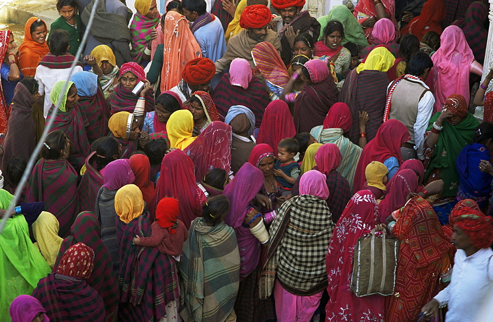 Women from villages crowd the street at the Camel Fair, Pushkar, Rajasthan state, India, Asia