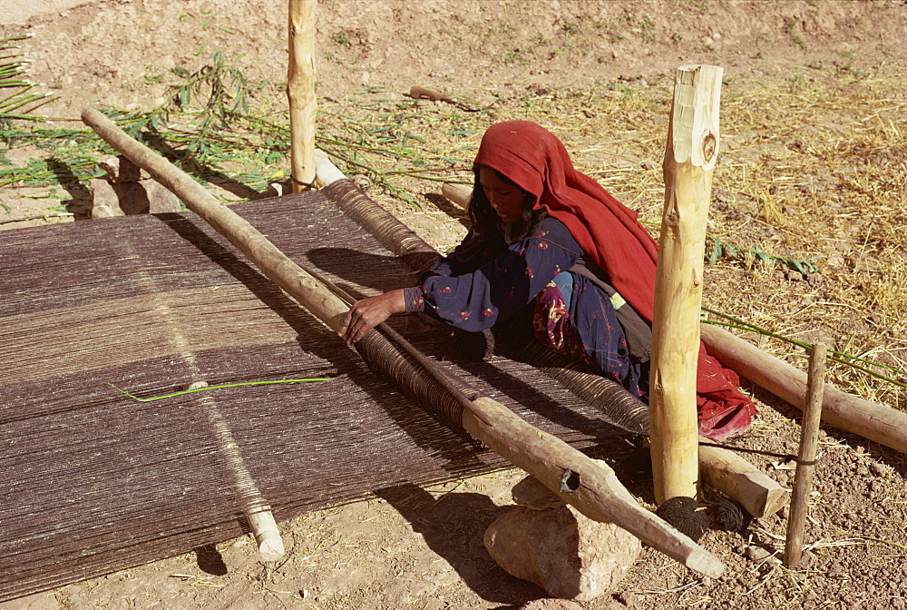 Woman weaving galim, a type of sacking, Afghanistan, Asia