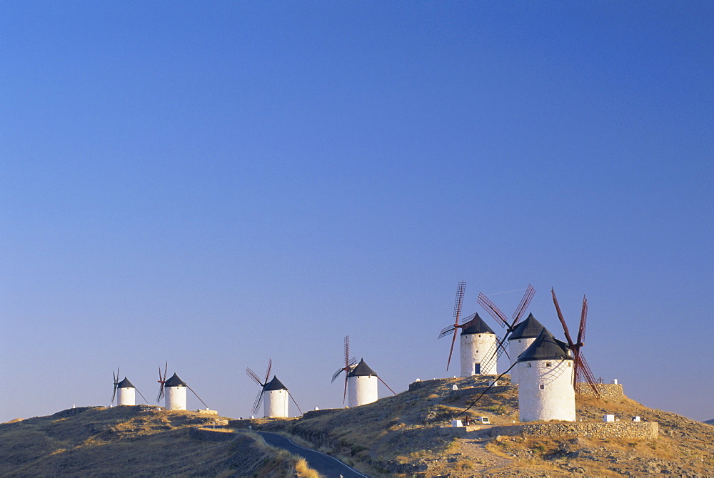 Distant view of hilltop windmills, as described in 'Don Quijote' (Don Quixote), Consuegra, Castilla-La Mancha, Spain, Europe