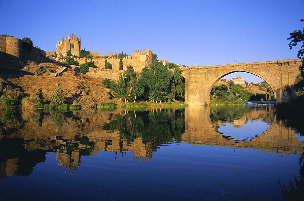 Monastery of San Juan de los Reyes and San Martin Bridge over the Rio Tajo (Tagus River), Toledo, Castilla-La Mancha, Spain, Europe