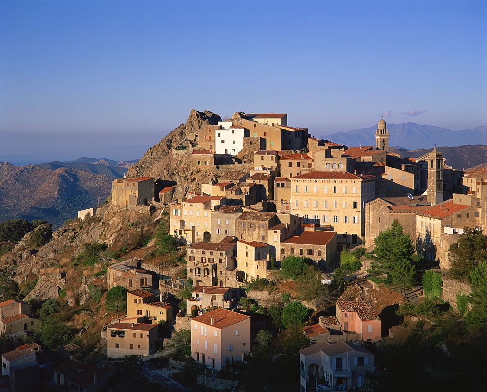 Clifftop village of Speloncato, in dusk light, Balagne region, Corsica, France, Europe