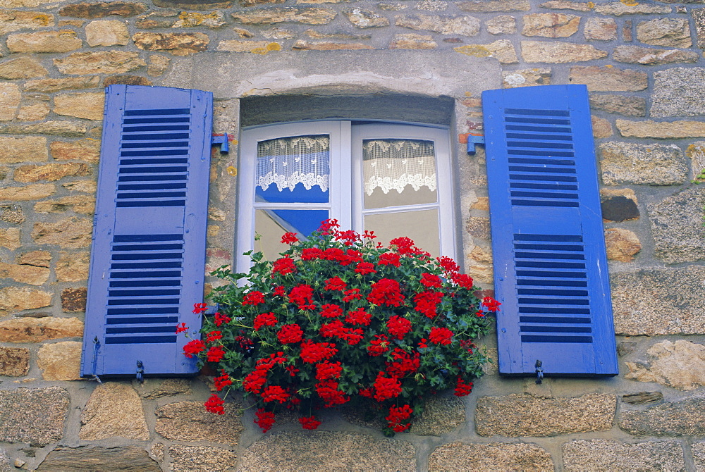 Blue shuttered windows and red flowers, Concarneau, Finistere, Brittany, France, Europe