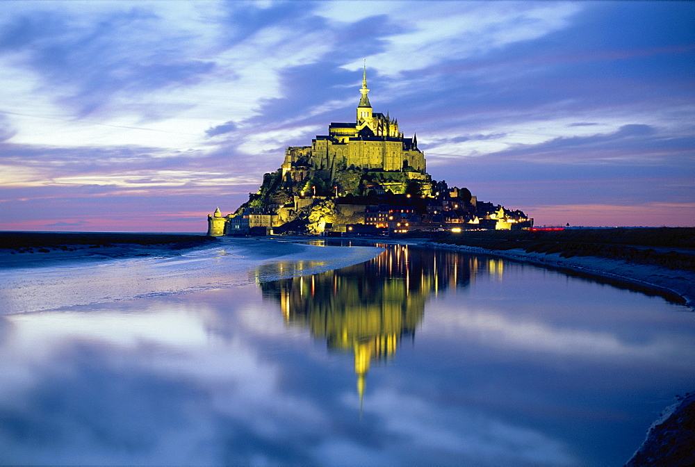 The mount by night reflected in water, Mont St Michel, Manche, Normandy, France 