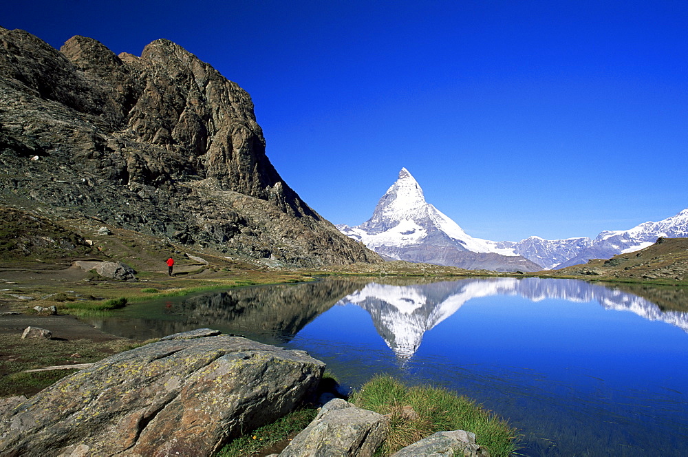 Matterhorn reflected in the Riffelsee, near Rotenboden, Zermatt, Valais, Swiss Alps, Switzerland, Europe