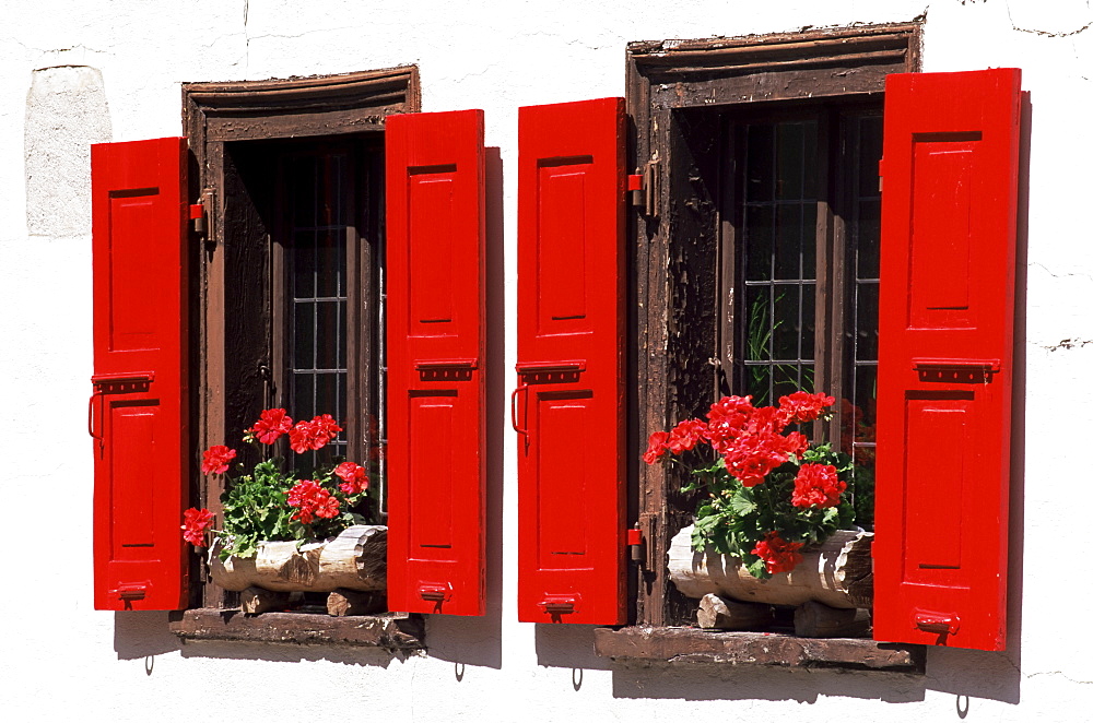 Red shuttered windows and geraniums, Tasch, near Zermatt, Valais, Switzerland, Europe