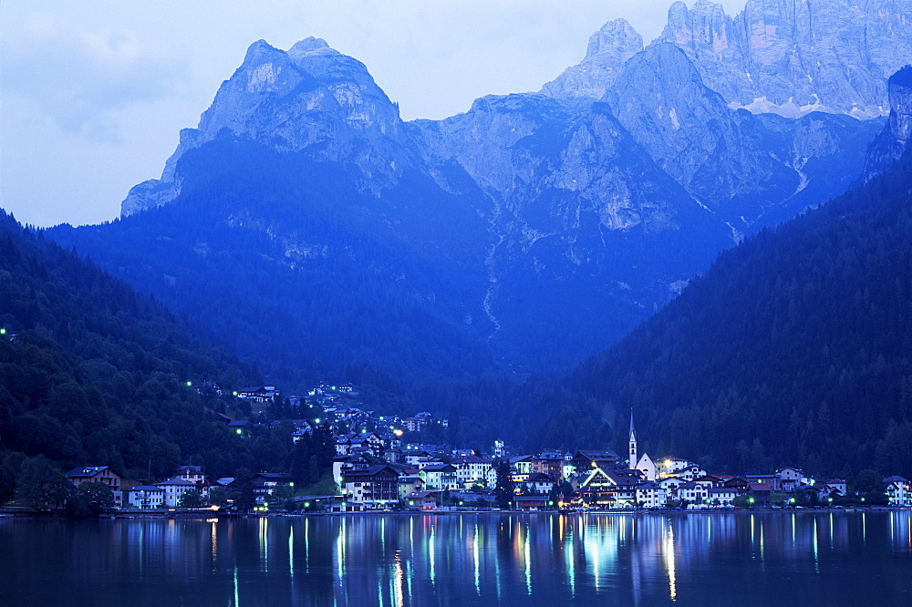 Alleghe and Lake Alleghe at dusk, with Monte Civetta towering above, Dolomites, Veneto, Italy, Europe