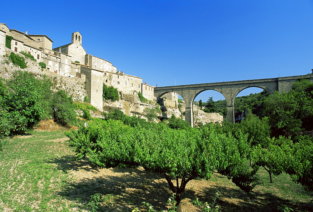 Village seen from floor of the Cesse River canyon, Minerve, Herault, Languedoc-Roussillon, France, Europe