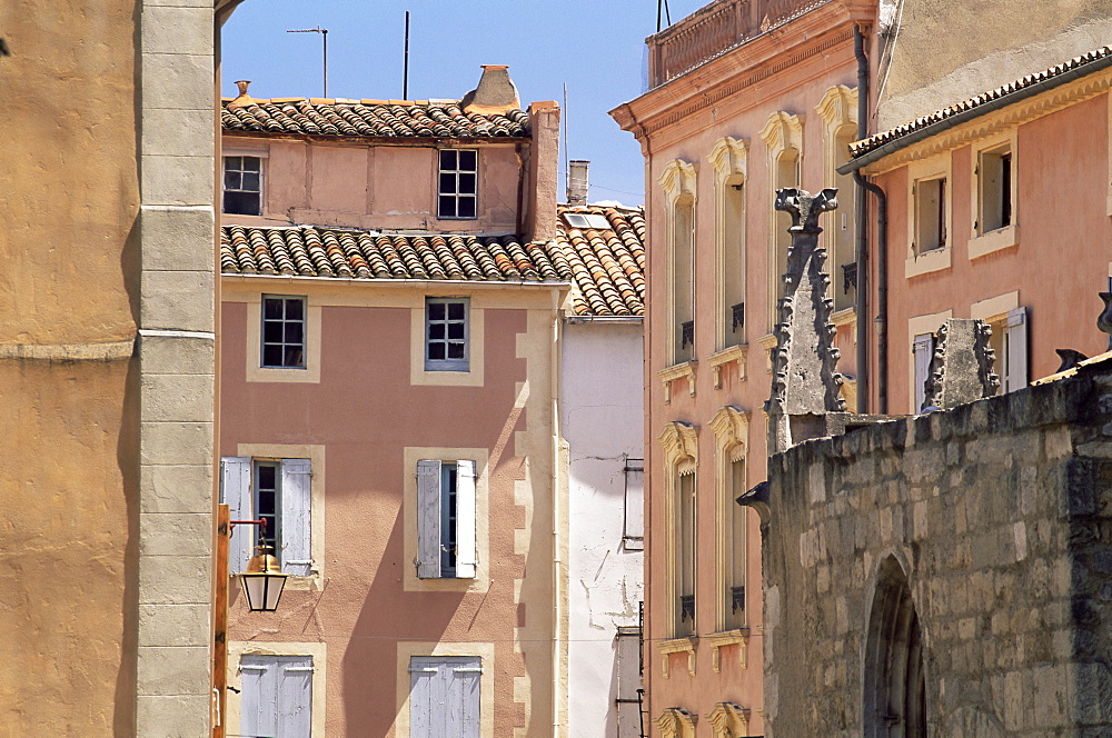 Pastel coloured facades in the Rue Droite, Narbonne, Aude, Languedoc-Roussillon, France, Europe