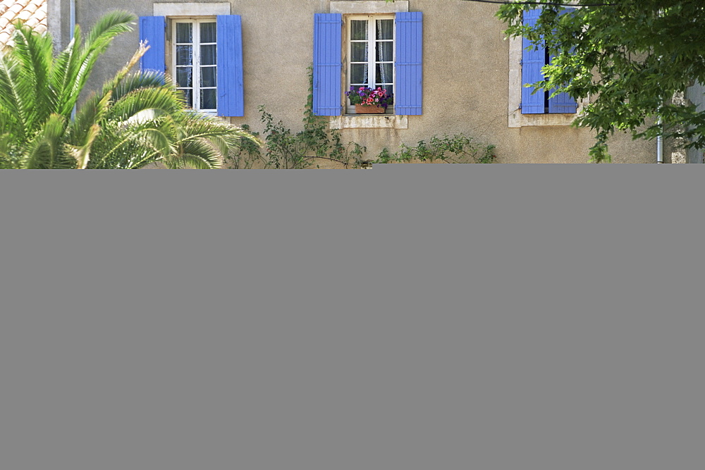 Boat moored alongside house on the bank of the Canal du Midi, Le Somail, Aude, Languedoc Roussillon, France, Europe