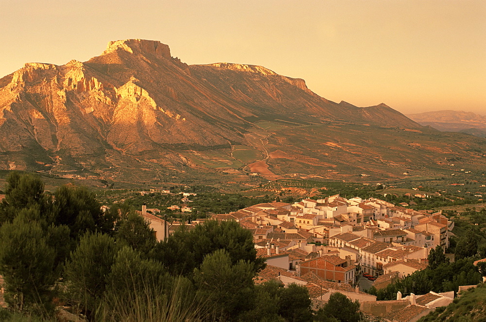 Velez Blanco nestled beneath the rocky peak of La Muela at sunset, Almeria, Andalusia (Andalucia), Spain, Europe