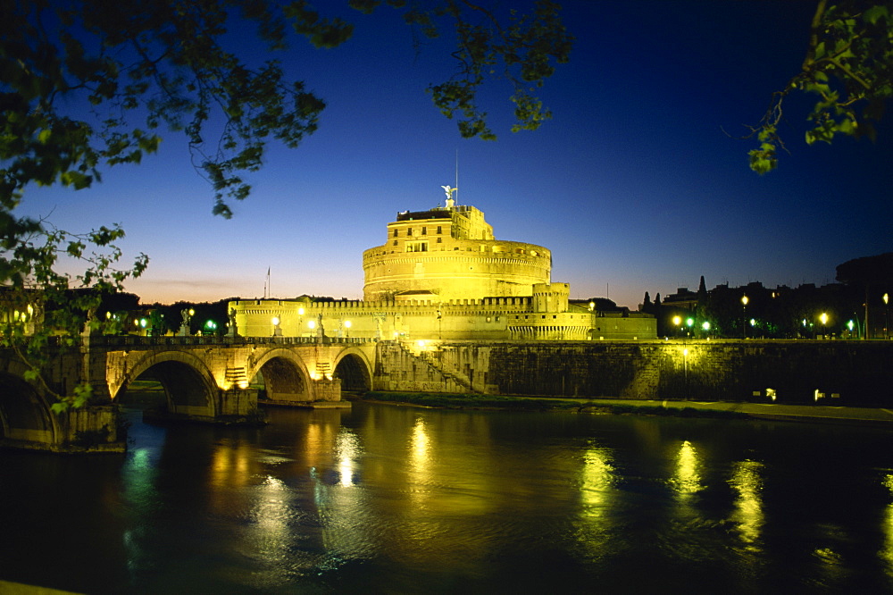 View across River Tiber to illuminated Castel Sant'Angelo at dusk, Rome, Lazio, Italy, Europe