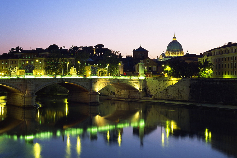 River Tiber and Ponte Vittorio Emanuele II at dusk, with St. Peter's basilica beyond, Rome, Lazio, Italy, Europe