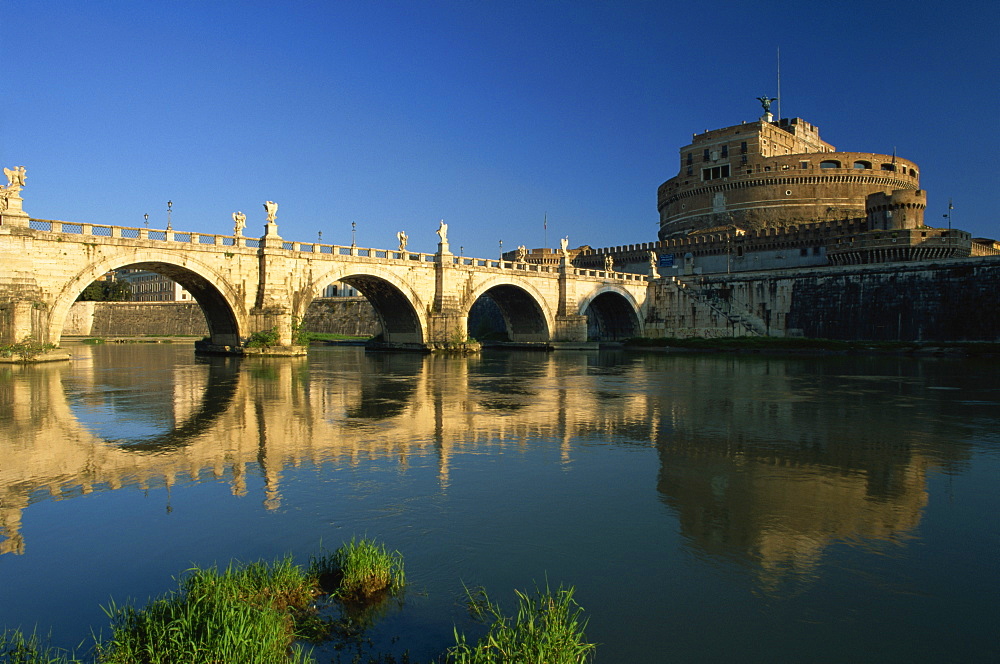 View across River Tiber to the Ponte Sant'Angelo and Castel Sant'Angelo, Rome, Lazio, Italy, Europe