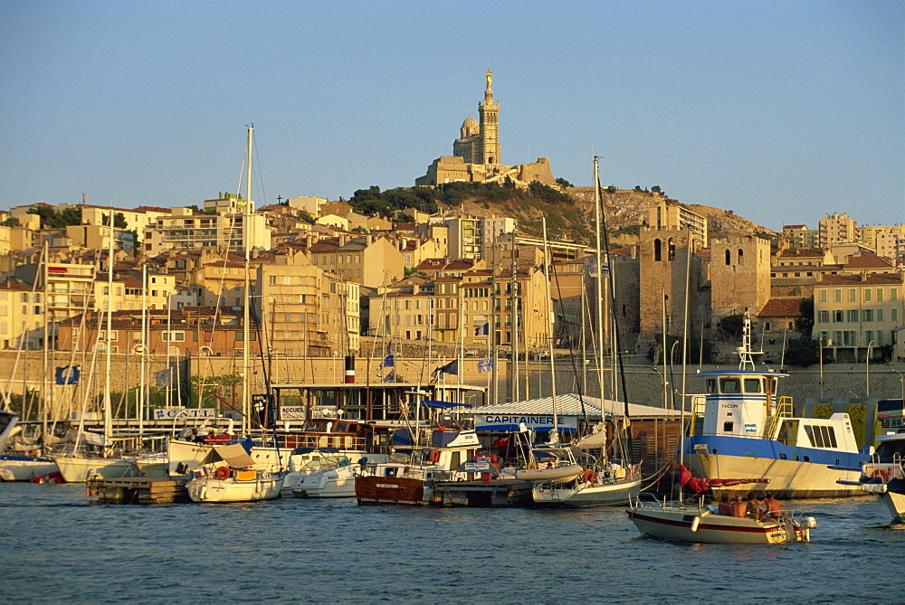 View across the Vieux Port to the basilica of Notre Dame de la Garde, Marseille, Bouches-du-Rhone, Provence, France, Mediterranean, Europe