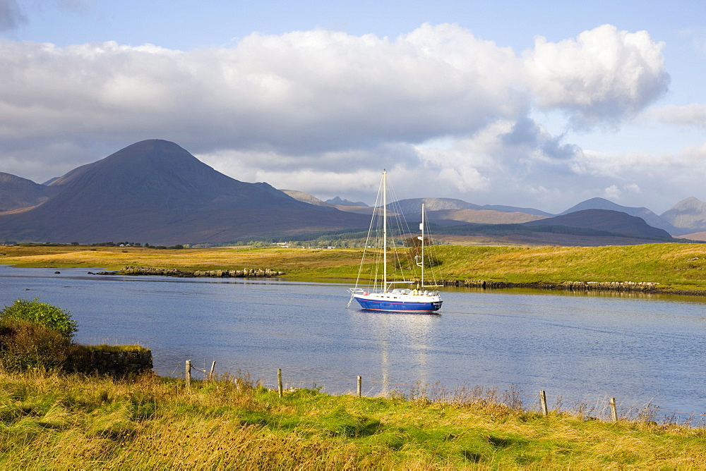 Yacht moored in inlet at Lower Breakish, near Broadford, Isle of Skye, Highland, Scotland, United Kingdom, Europe