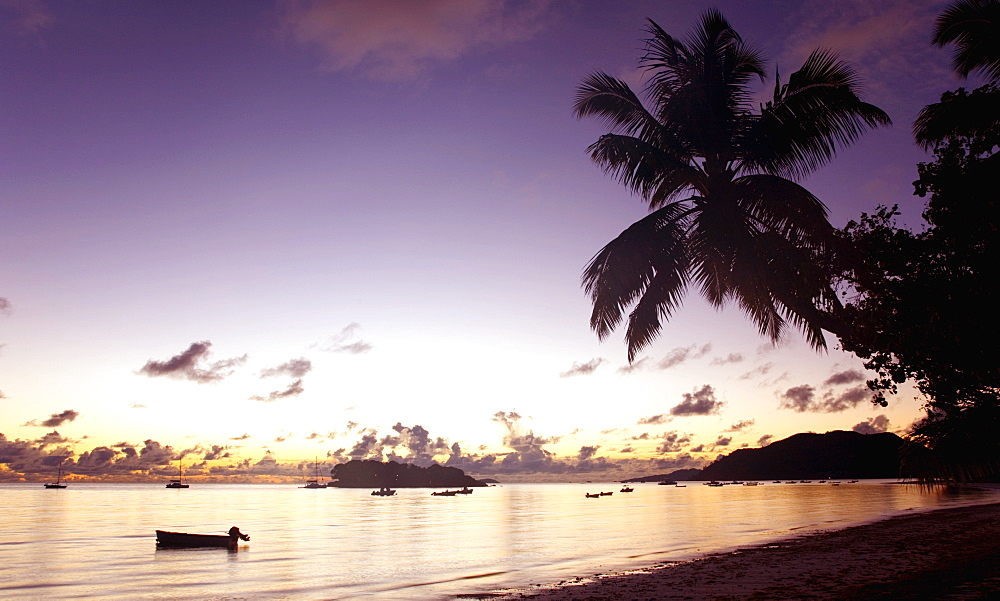 View across Anse Volbert to the offshore island of Chauve Souris at dawn, Baie Sainte Anne district, Island of Praslin, Seychelles, Indian Ocean, Africa