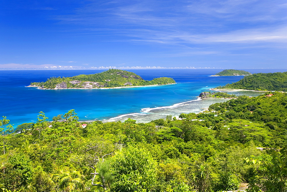 View across Anse l'Islette to the offshore islands of Therese and Conception from hillside above Port Glaud, Port Glaud district, Island of Mahe, Seychelles, Indian Ocean, Africa