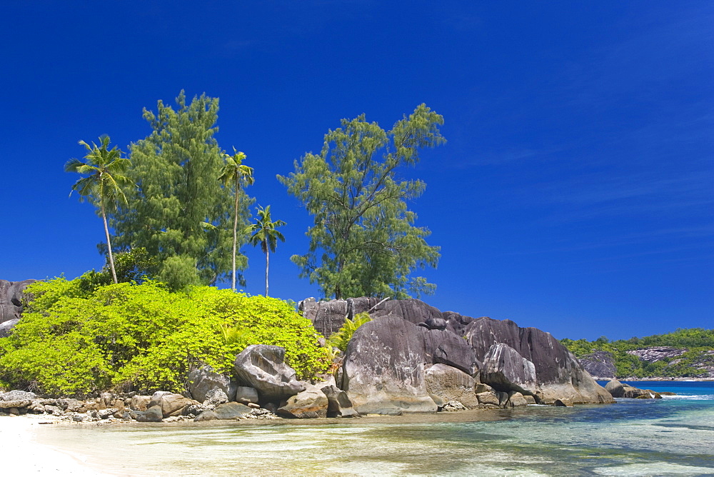 Granite outcrop on the beach, Port Glaud, Port Glaud district, Island of Mahe, Seychelles, Indian Ocean, Africa