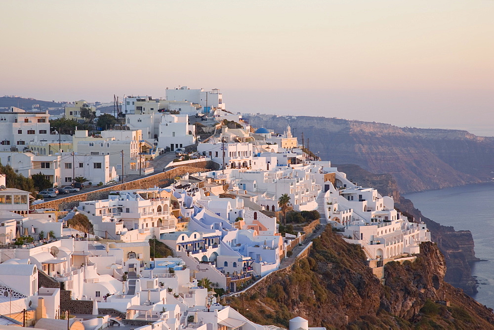 The village lit by the setting sun, Firostefani, Santorini (Thira) (Thera), Cyclades Islands, South Aegean, Greek Islands, Greece, Europe