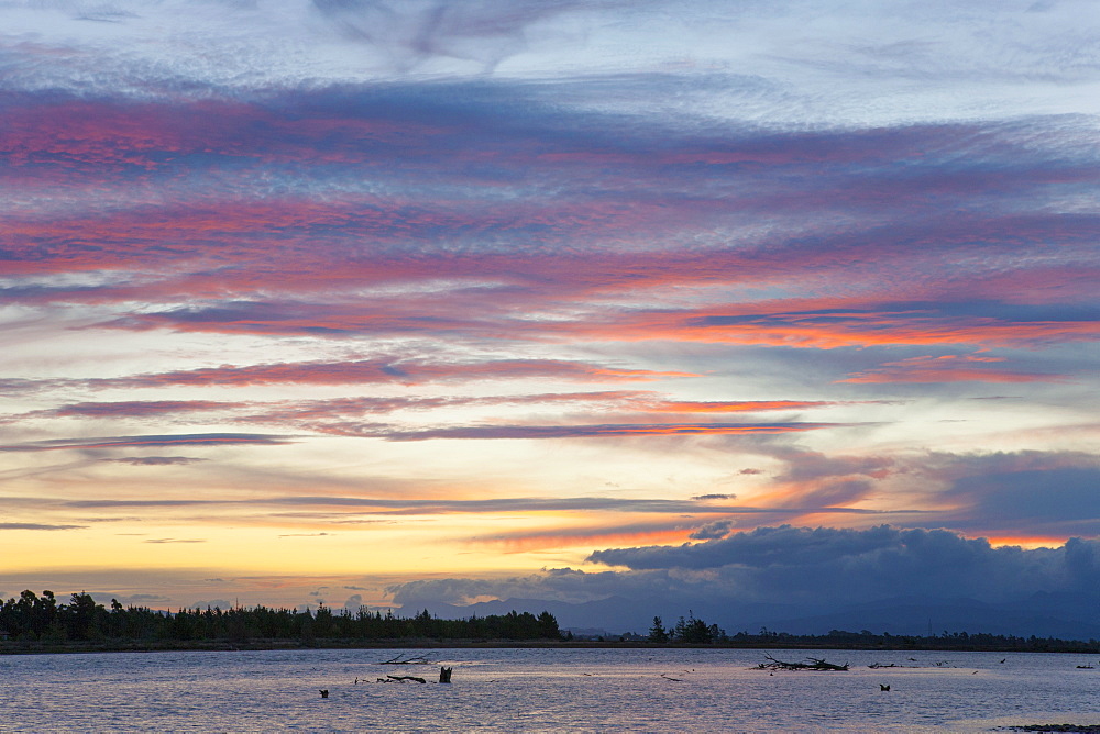 Pink clouds over the Wairau River estuary at dusk, Wairau Bar, near Blenheim, Marlborough, South Island, New Zealand, Pacific